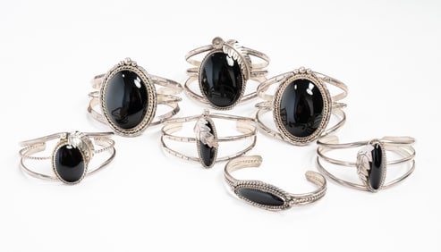 NAVAJO STERLING AND ONYX CUFF BRACELETS.