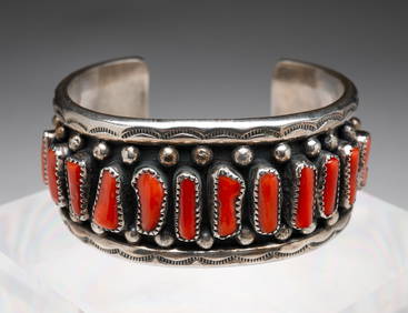 NAVAJO SIGNED CORAL AND SILVER CUFF BRACELET. (1 of 3)