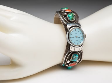 JOE BARELA NAVAJO TURQUOISE AND CORAL WATCH CUFF.