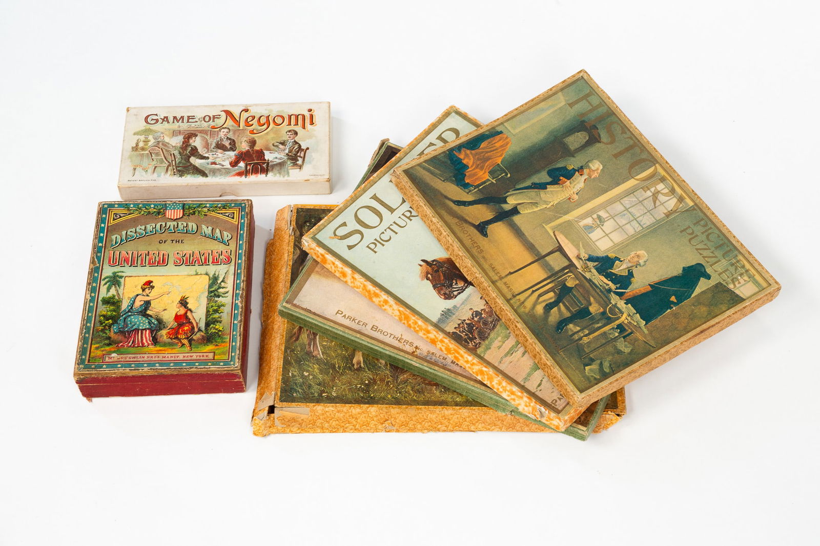 FOUR PARKER BROTHERS PICTURE PUZZLES, A MCLOUGHLIN DISSECTED MAP OF THE UNITED STATES, AND A GAME OF (1 of 9)