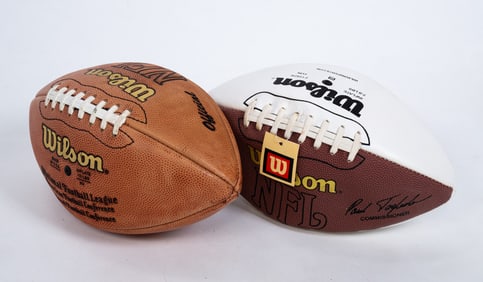 TWO AUTOGRAPHED FOOTBALLS.