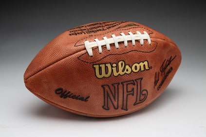 AUTOGRAPHED FOOTBALL BY DAN REEVES.