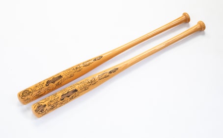 TWO (2) CLEVELAND INDIANS 1997 COMMEMORATIVE BASEBALL BATS.