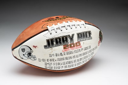 COMMEMORATIVE FOOTBALL AUTOGRAPHED BY JERRY RICE.