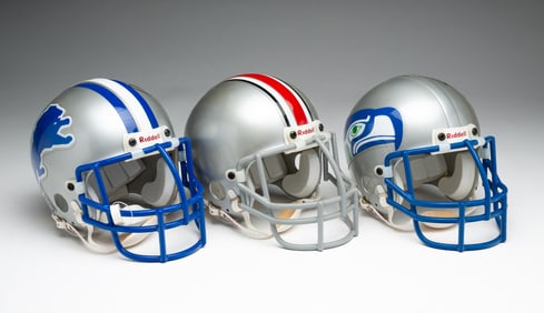 THREE AUTOGRAPHED MINI-HELMETS
