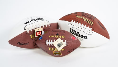 TWO (2) FOOTBALLS AUTOGRAPHED BY CHAD OCHOCINCO AND A LIMITED EDITION COMMEMORATIVE SUPER BOWL