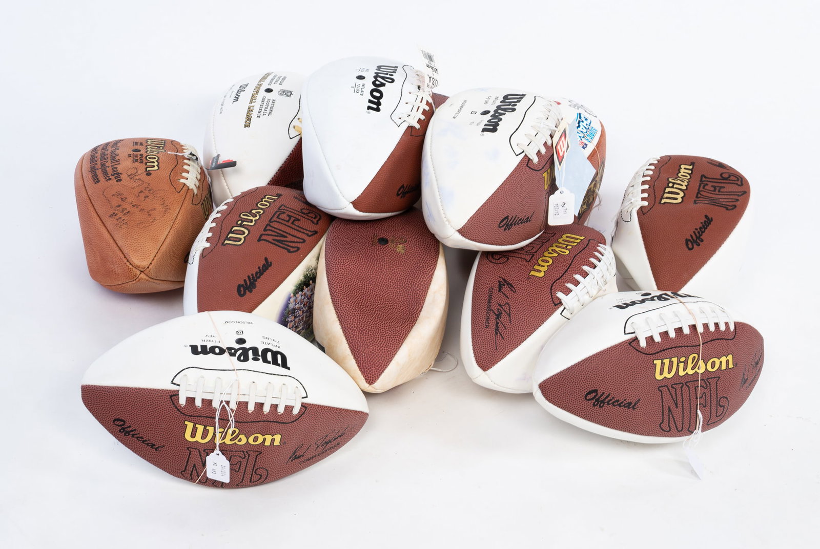 SIX (6) MISCELLANEOUS FOOTBALLS: American, 20th - 21st Century.One Autographed Football by Howard "Hopalong" Cassidy. ONFL Tagliabue football signed and inscribed "85". Cassidy won the Heisman Trophy in college, playing for the Ohio 
