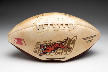 AUTOGRAPHED CINCINNATI BENGALS CHAMPIONS COMMEMORATIVE FOOTBALL BY LORENZO NEAL AND COREY DILLON.