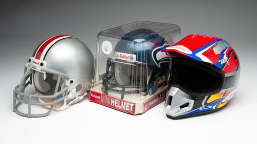 THREE MINI HELMETS.