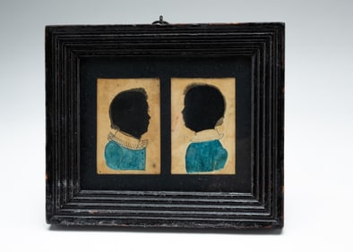 DOUBLE HOLLOW CUT SILHOUETTES OF CHILDREN.
