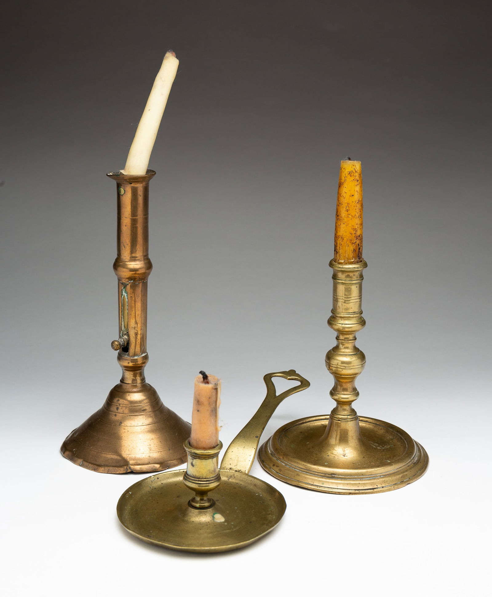 THREE EARLY CANDLESTICKS. (1 of 5)