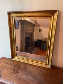 MIRROR WITH GOLD LEAF FRAME.