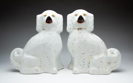 PAIR OF STAFFORDSHIRE PORCELAIN SPANIELS.