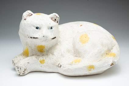 CHALK CAT WITH YELLOW SPOTS.