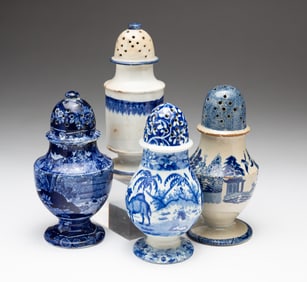 FOUR BLUE AND WHITE TRANSFERWARE PEPPER POTS.