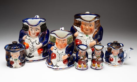 GROUP OF ALLERTON'S AND STAFFORDSHIRE TOBY JUGS AND A MINIATURE TEA SERVICE.