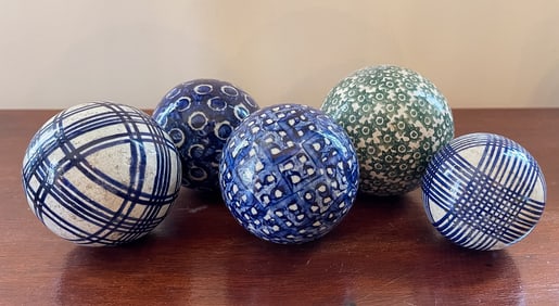 FIVE CARPET BALLS.