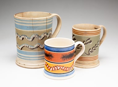 THREE MOCHAWARE DECORATED TANKARDS.