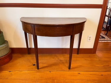 HEPPLEWHITE DEMILUNE TABLE.