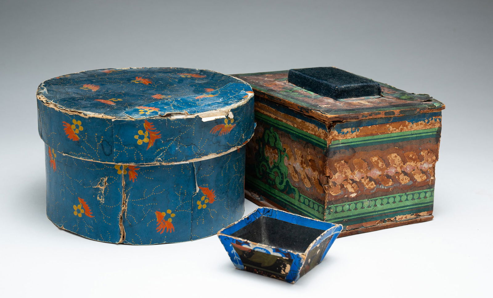 THREE WALLPAPER DECORATED CONTAINERS. (1 of 5)