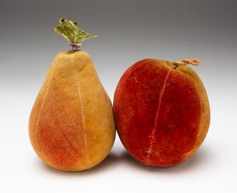 TWO VELVET FRUIT PINCUSHIONS.