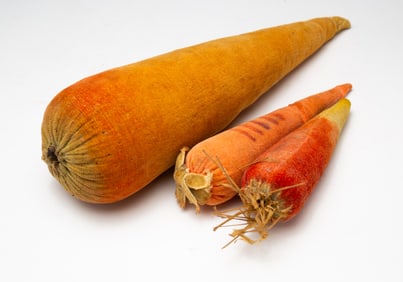 THREE VELVET CARROT PINCUSHIONS.