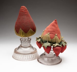 TWO FOLK ART STRAWBERRY MAKE-DO PINCUSHIONS.