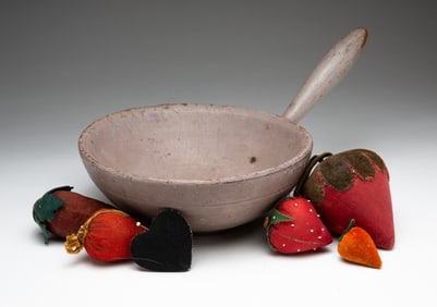 PAINTED HANDLED BOWL AND SIX PINCUSHIONS.