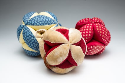 THREE SEWING BALL PINCUSHIONS.