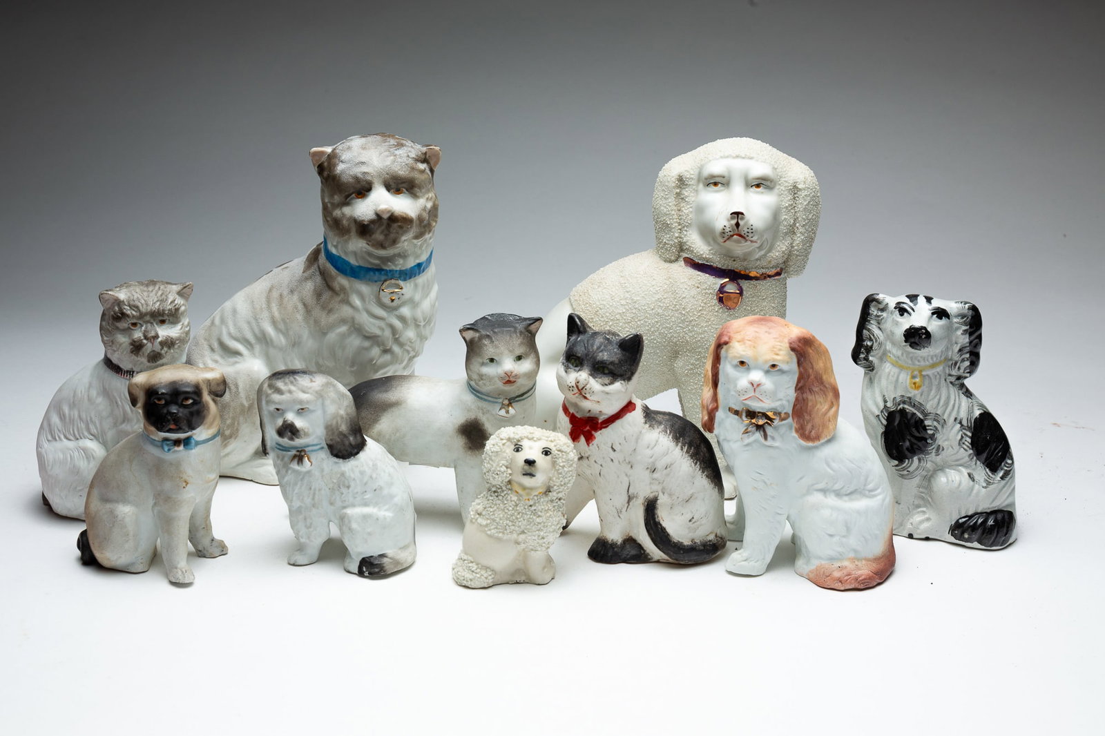 COLLECTION OF CATS AND DOGS.: England and German, 19th and 20th Centuries. Mostly bisque. From 7.5''h. to 3''h.