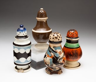 FOUR MOCHAWARE DECORATED PEPPER POTS.