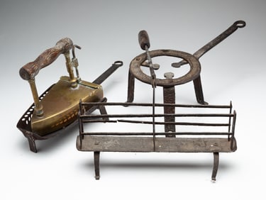 THREE WROUGHT IRON AND BRASS HEARTH ITEMS.