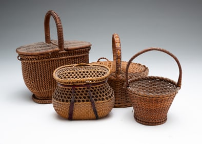 FOUR FINELY WOVEN MINIATURE BASKETS.