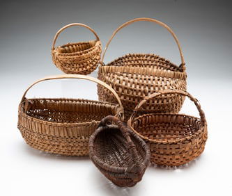 FIVE DIMINUTIVE HANDLED BASKETS.