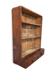GRAIN PAINTED HANGING SHELVES WITH DRAWERS.