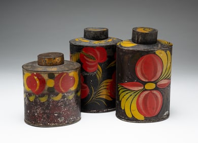 THREE TOLE TEA CADDIES.