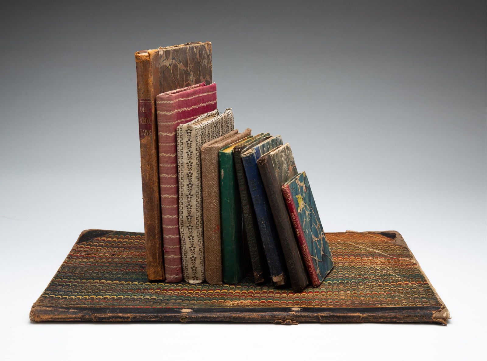 TEN BOOKS WITH MARBLED AND SEWN CLOTH COVERS. (1 of 11)