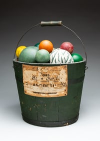 STAVE CONSTRUCTED BUCKET WITH FILLED BALLS.