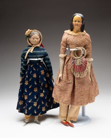 TWO DIMINUTIVE DOLLS.