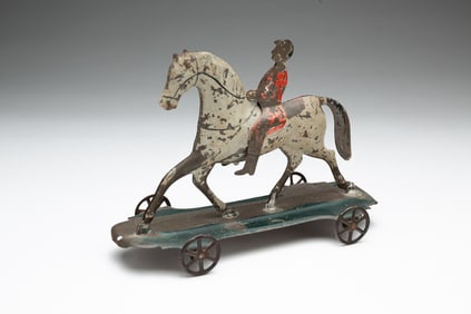 PRESSED TIN AND PAINTED HORSE PULL TOY.