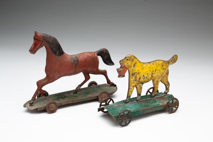 TWO PRESSED TIN AND PAINTED PULL TOYS.