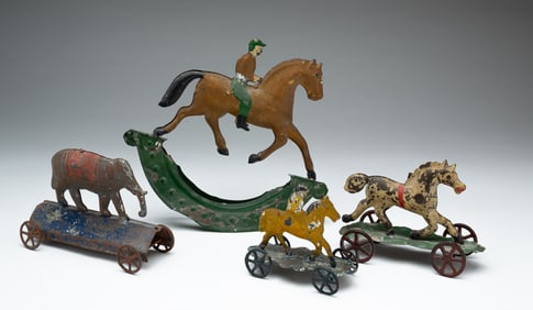 FOUR TIN TOYS.