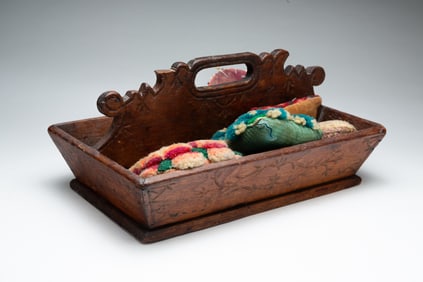 WOOD TOTE WITH SEWING NOTIONS.