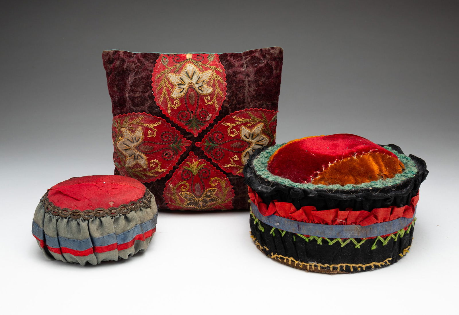 THREE VICTORIAN PINCUSHIONS. (1 of 3)