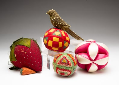 GROUP OF SIX PINCUSHIONS.