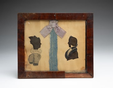 DOUBLE HOLLOW CUT SILHOUETTES OF A HUSBAND AND WIFE.
