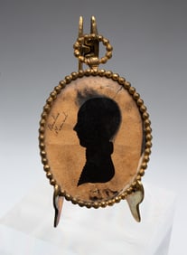 INK AND HOLLOW CUT SILHOUETTE PORTRAIT OF A MAN.