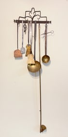 HANGING RACK WITH HEARTHSIDE UTENSILS.