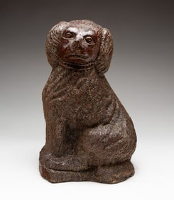OHIO SEWER TILE SEATED SPANIEL DOG WITH COMBED FUR.