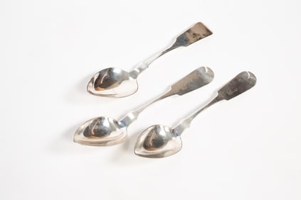 THREE COIN SILVER SERVING SPOONS.